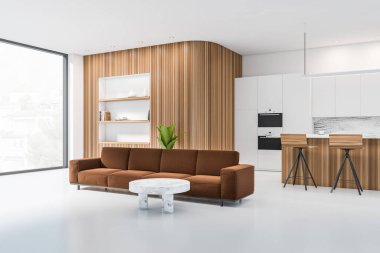 Beyaz mutfak içi kanepe, iki bar sandalyesi ve açık beton zeminde kahve masası, yan manzara, kırsal manzaralı panoramik pencere. Askısı ve dekorasyonu olan ahşap duvar, 3 boyutlu.