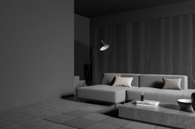 Oturma odasının içinde kanepe, kahve masası, kitaplar ve kamış ayırıcı var. Gri beton zeminde halı ve lamba, yan manzara. Boşluk boş gri duvarı kopyala, 3B görüntüleme