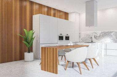 Parlak mutfak manzarası çift fırın, dört koltuklu yemek masası ve beton zemin. Minimalist tasarım kavramı. Yaratıcı fikir için yer var. 3d oluşturma