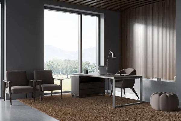 Corner view on dark office room interior with desk with laptop, concrete floor, three armchairs and panoramic window with countryside view. Concept of ceo. Place for working process. 3d rendering