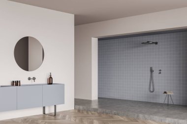 Podyumda duşlu bir banyo, güvertede yuvarlak ayna ve dekorasyonla lavabo, ahşap zemin. Otel stüdyosunda şık bir banyo. 3B görüntüleme