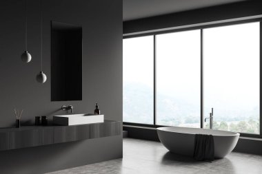 Koyu banyonun iç tarafında küvet, kırsal manzaralı panoramik pencere, ayna ve lavabo, gri duvarlar ve beton zemin. Hijyenik kavramı ve sağlık prosedürleri. 3d oluşturma