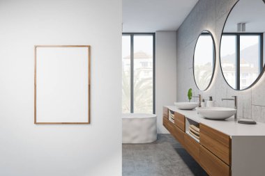 Banyonun içinde gri beton zeminde küvet, yuvarlak aynalı iki lavabo, aksesuarlı güverte. Beyaz duvara çerçeve yap. 3B görüntüleme