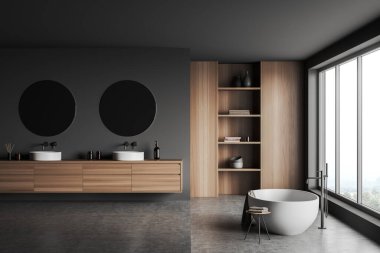 Koyu banyonun iç tarafında küvet, kırsal manzaralı panoramik pencere, iki yuvarlak ayna ve lavabo, gri duvarlar ve beton zemin. Kitaplı gardırop, tabure. 3d oluşturma