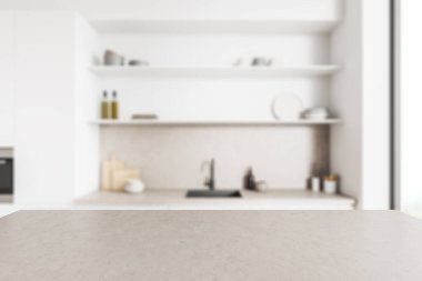 Grey concrete countertop on background of blurred white kitchen interior with sink and kitchenware, shelf and window. Mockup copy space for product display. 3D rendering