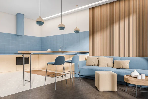 Blue kitchen interior with sofa and bar chairs, dining countertop. Chill zone and eating area with modern furniture, tile and concrete floor. 3D rendering