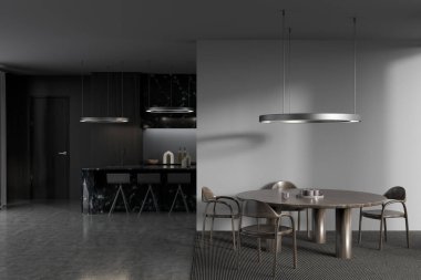 Dark kitchen interior with bar chairs and dining table with seats, countertop on grey concrete floor, kitchenware. Stylish cooking space and eating area. 3D rendering