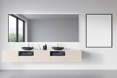 Front view on bright bathroom interior with empty white poster, panoramic window with countryside view in reflection at mirror, sinks, white walls and concrete floor. Mock up. 3d rendering