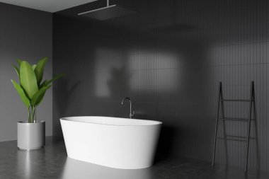 Corner view on dark bathroom interior with bathtub, plant, grey walls and concrete floor. 3d rendering