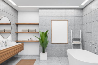 Front view on bright bathroom interior with empty white poster, bathtub, round mirror and sink, grey walls, shelf with towels, houseplant, carpet, concrete tile floor. Mock up. 3d rendering