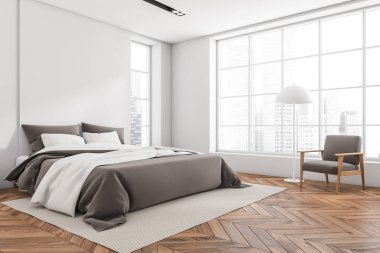 White bedroom interior with bed on carpet, armchair with lamp on hardwood floor, side view. Panoramic window on Singapore city view. 3D rendering