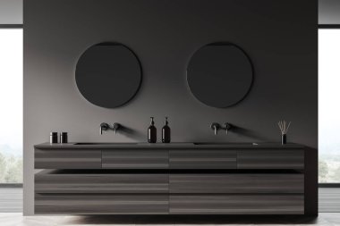 Çift lavabolu, yuvarlak aynalı, kırsal manzaralı karanlık bir banyo. Banyo aksesuarlı modern dolap, ön manzara. 3B görüntüleme