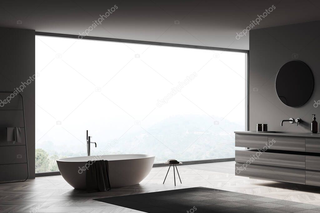 Dark bathroom interior, bathtub and towel rail ladder, side view, sink with wooden deck, accessories and mirror. Panoramic window on countryside. 3D rendering