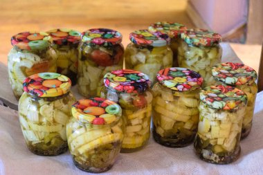 picture with glass jars, storing products for the winter, home canning concept