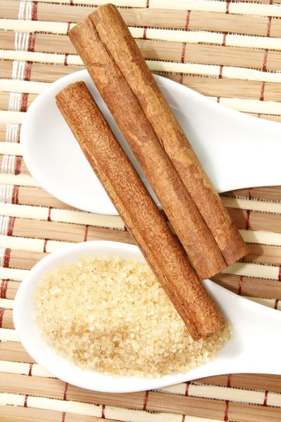 Cinnamon sticks with cane sugar — Stock Photo, Image