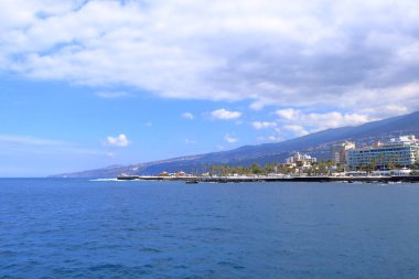 November 20 2021 - Puerto de la Cruz, Tenerife, Canaries: harbor and coastline in the sun