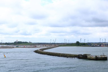 June 2 2022 - Puttgarden, Germany: Cranes and excavators are working at a new port facility for the Fehmarnbelt Tunnel Link project that will link Denmark and Germany