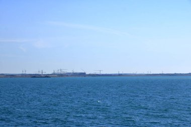 June 2 2022 - Roedby, Denmark: Cranes and excavators are working at a new port facility for the Fehmarnbelt Tunnel Link project that will link Denmark and Germany