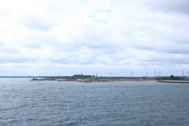 June 2 2022 - Puttgarden, Germany: Cranes and excavators are working at a new port facility for the Fehmarnbelt Tunnel Link project that will link Denmark and Germany