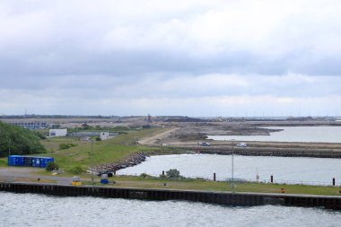 June 2 2022 - Roedby, Denmark: Cranes and excavators are working at a new port facility for the Fehmarnbelt Tunnel Link project that will link Denmark and Germany