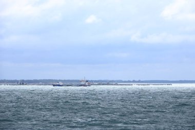 June 2 2022 - Roedby, Denmark: Cranes and excavators are working at a new port facility for the Fehmarnbelt Tunnel Link project that will link Denmark and Germany
