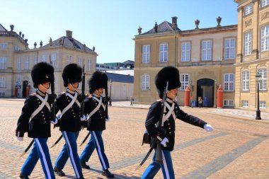 May 23 2022 - Copenhagen, Denmark: Guards marching outside royal palace at Amalienborg