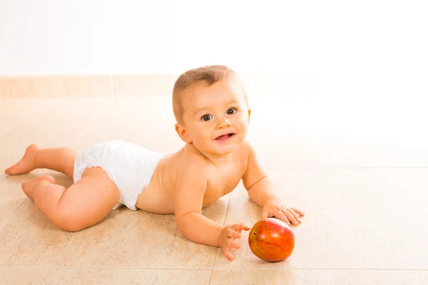 Baby playing with apple — Stock Photo, Image