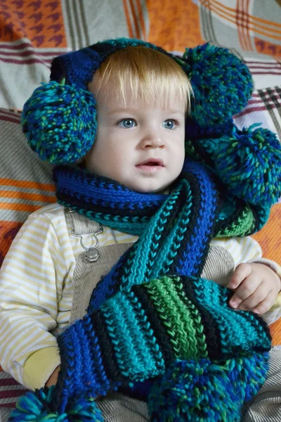 Portrait of little boy in a green scarf — Stock Photo, Image