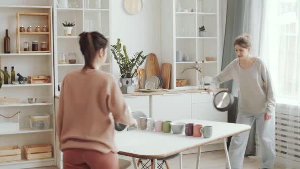 Two Young Women Playing Table Tennis Frying Pans Racquets Tea — Stock Video