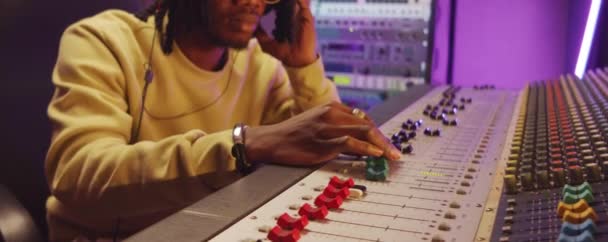 Close Shot African American Man Headphones Working Mixing Desk While — Stock Video