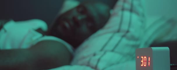 Sleepless African American Man Lying Bed Night Looking Digital Clock — Stock Video