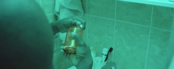 African American Man Standing Bathroom Looking Mirror Taking Pills Drinking — Stock Video