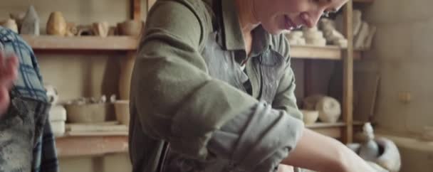 Close Shot Young Female Trainee Shaping Clay Listening Senior Sculptor — 图库视频影像