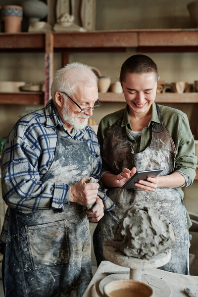 Potters working in team in studio