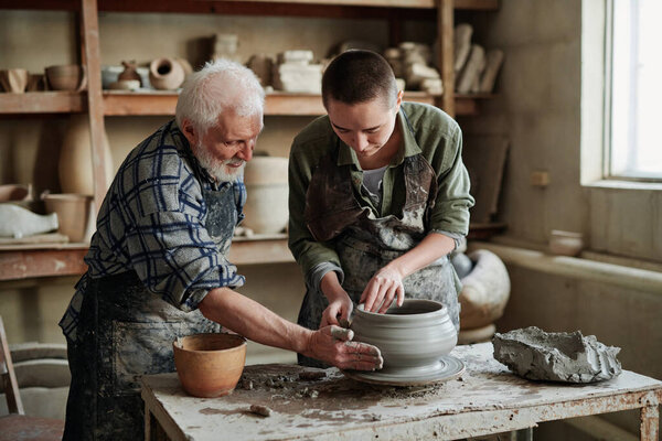 Pottery artists making earthenware vases