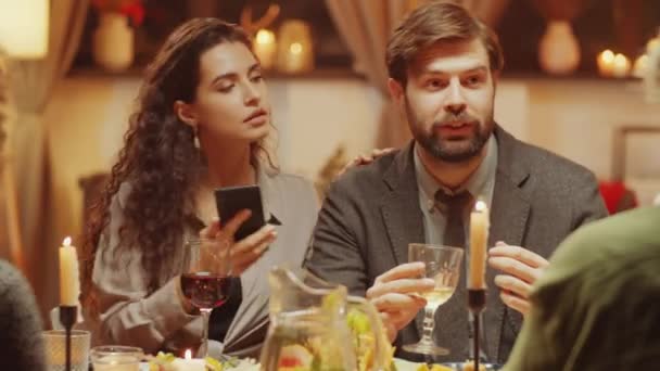 Portrait Young Woman Sitting Dining Table Interrupting Her Boyfriend Showing — Stock Video