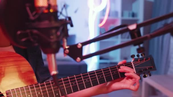 Close Tilt Shot Young Talented Asian Woman Headphones Playing Guitar — Stock video