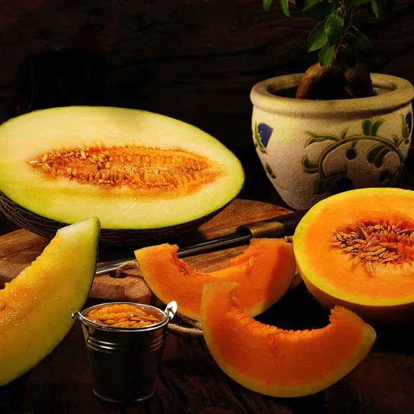 Ripe beautiful melon, cut, lies on the table. Tasty and beautiful.