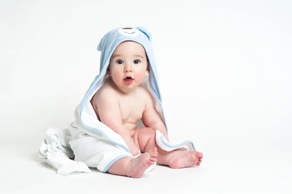 Cute baby in a towel isolated on white background — Stock Photo, Image