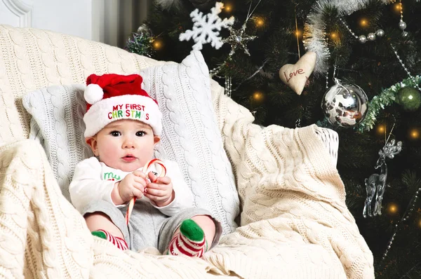 New year baby under the christmas tree Stock Picture