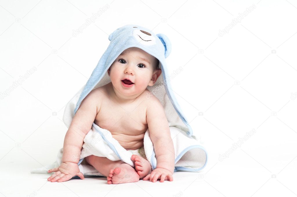 Cute baby in a towel isolated on white background