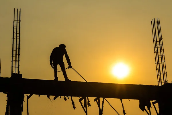 Silhouette of constructionworker on constructionsite Royalty Free Stock Images