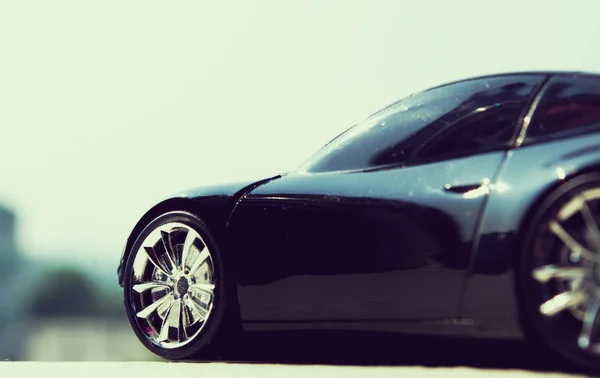 Black car in retro concept — Stock Photo, Image