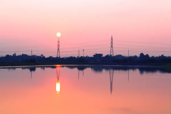 Telefoonpalen op zonsondergang — Stockfoto