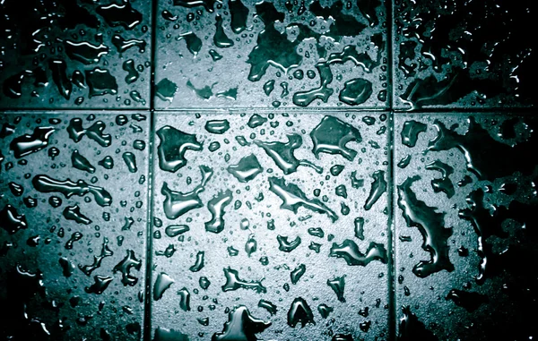 Druppels water op de vloer — Stockfoto