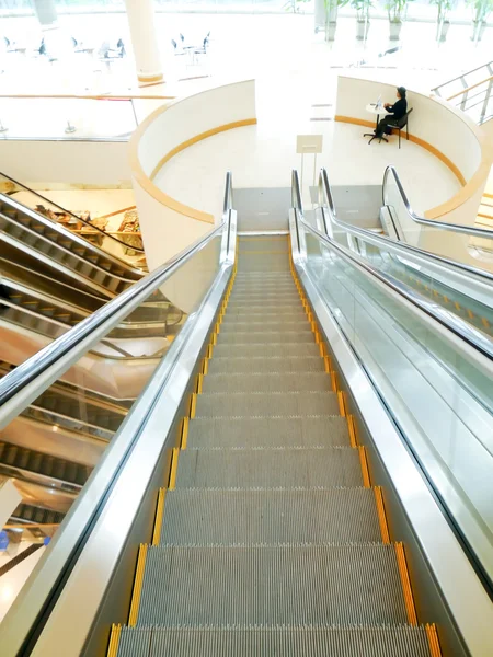 Spiral staircase and escalator — Stock Photo, Image