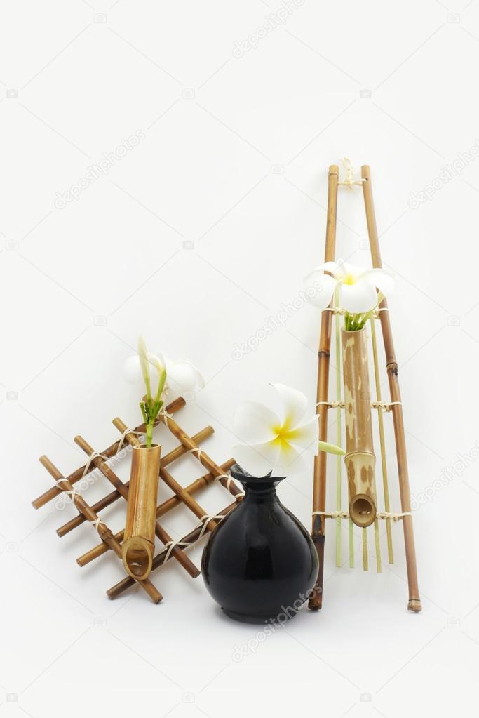 Hanging bamboo basket of flowers.
