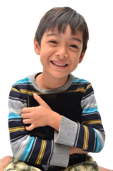 Счастливый маленький мальчик с планшетом — стоковое фото