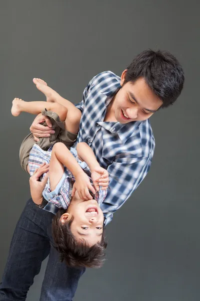 Father holding son with happy face — Stock Photo, Image