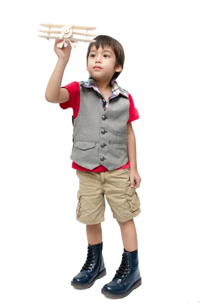 Niño jugando con un avión de juguete. Aislado sobre respaldo blanco — Foto de Stock